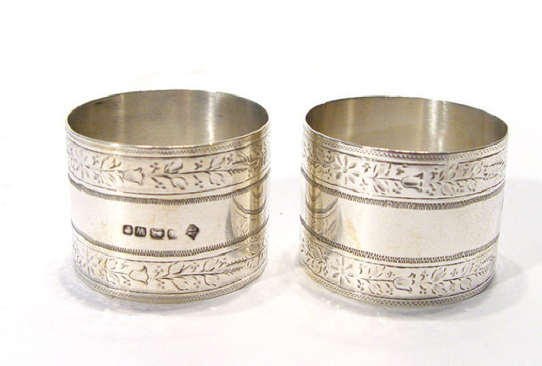 Appraisal: Two Victorian silver napkin rings chased with two bands of