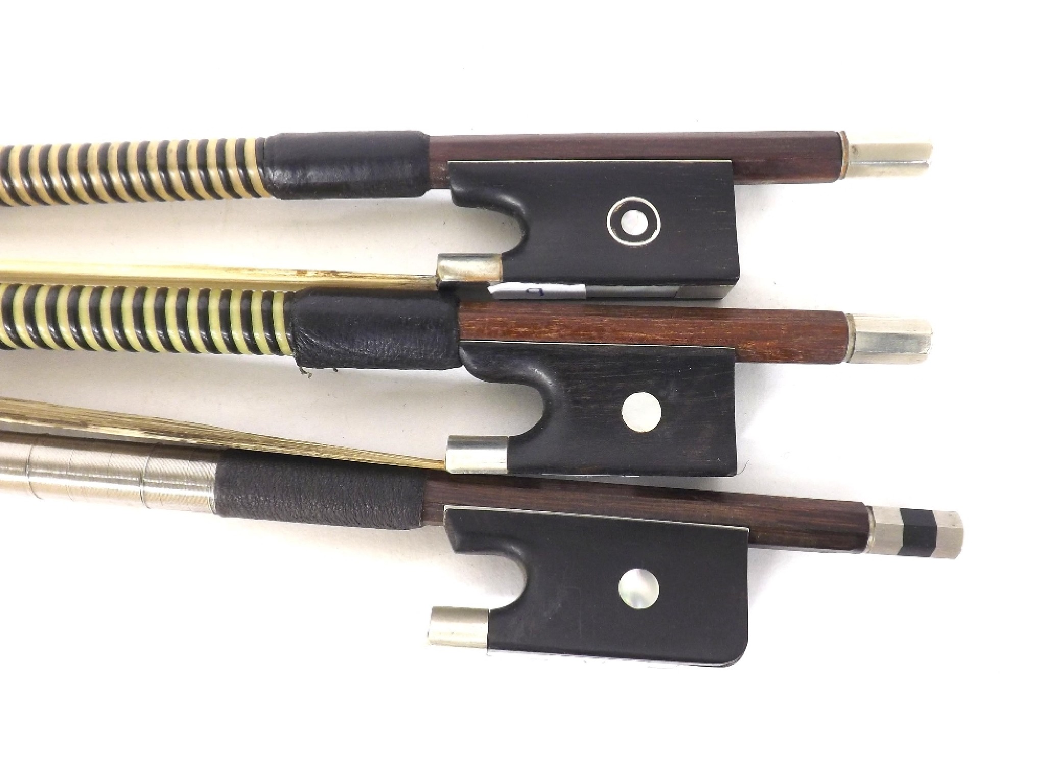 Appraisal: Three nickel mounted bows one full size violin bow three-quarter