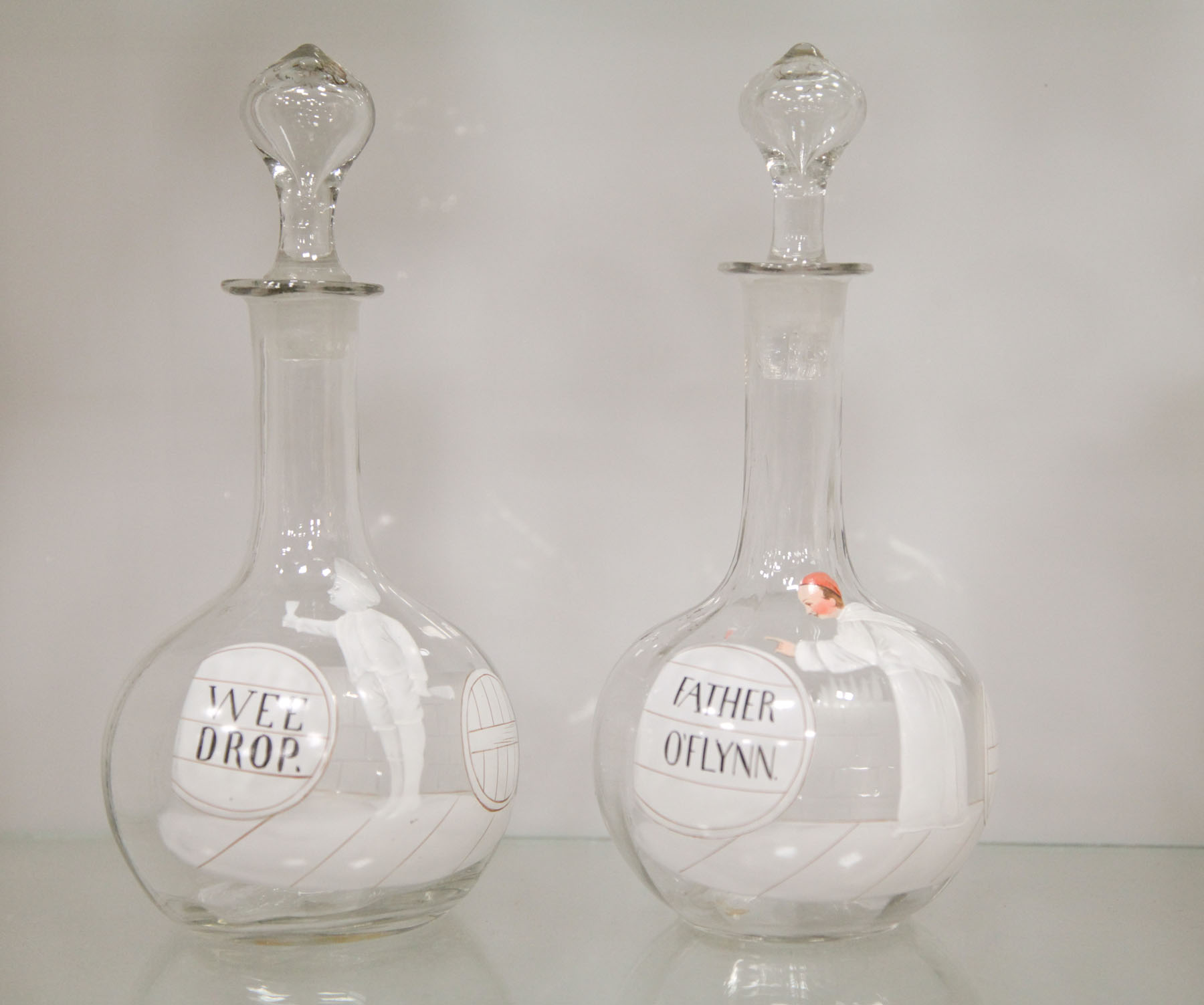 Appraisal: TWO MARY GREGORY DECANTERS American early th century Clear glass