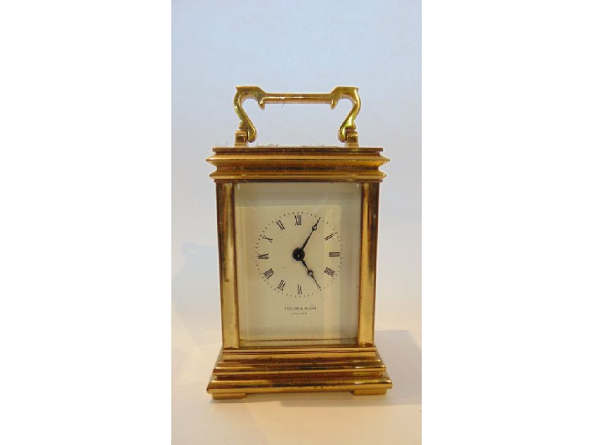 Appraisal: A miniature brass carriage clock with eight day timepiece Taylor