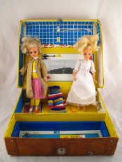 Appraisal: A Sindy suitcasewith two Sindy dolls complete with their wardrobe