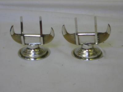 Appraisal: A PAIR OF EDWARDIAN MENU HOLDERS with mounted claw terminals