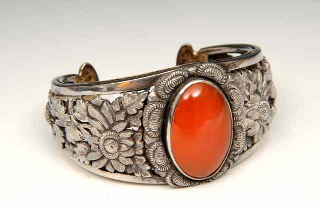 Appraisal: A CHINESE SILVER BANGLE pierced and chased flower design circa