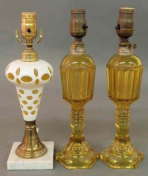 Appraisal: Pair of amber glass fluid lamps h c converted to