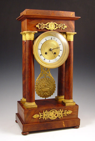 Appraisal: FRENCH WOOD GILT METAL DECORATED PORTICO CLOCK Portico clock with