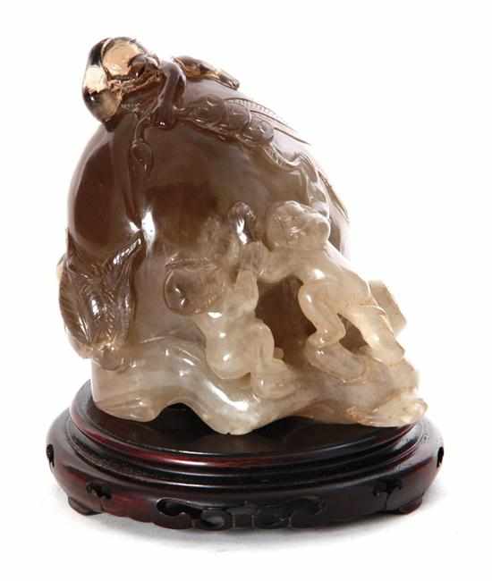 Appraisal: Chinese carved rock crystal longevity figure Qing Dynasty smoky-gray variegated