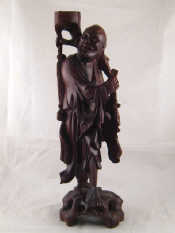 Appraisal: A carved wooden figure of a Chinese man with inset