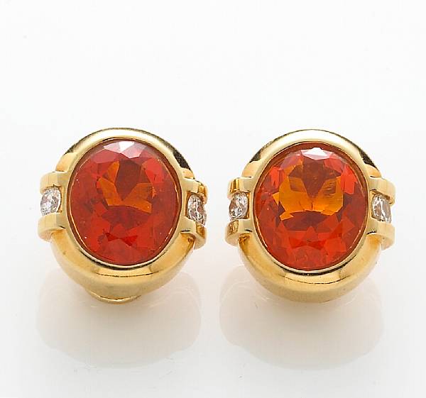 Appraisal: A pair of fire opal and diamond earclips mounted in