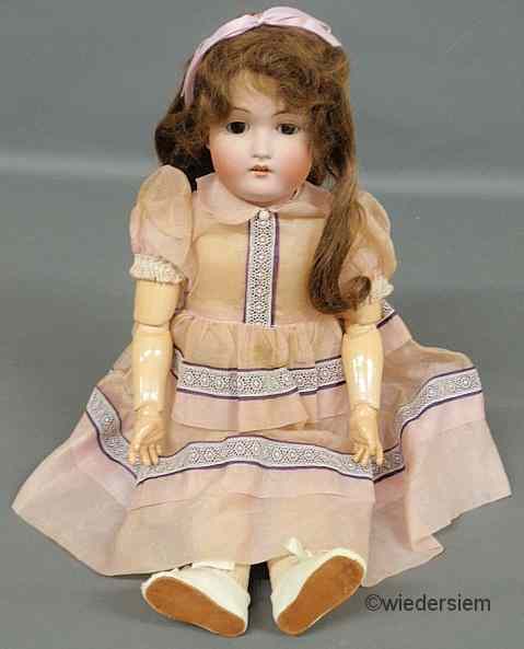 Appraisal: German bisque head doll with composition hands and wooden joints