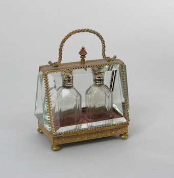 Appraisal: A Miniature Perfume Tantalus Fashioned with an armature of stamped