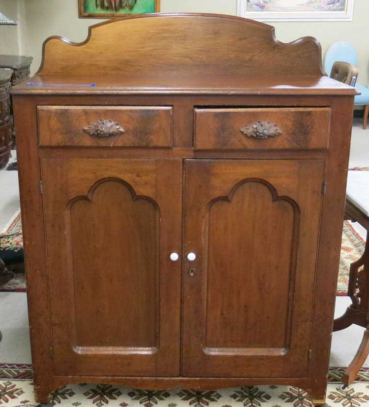 Appraisal: A VICTORIAN WALNUT CABINET American c the front having two