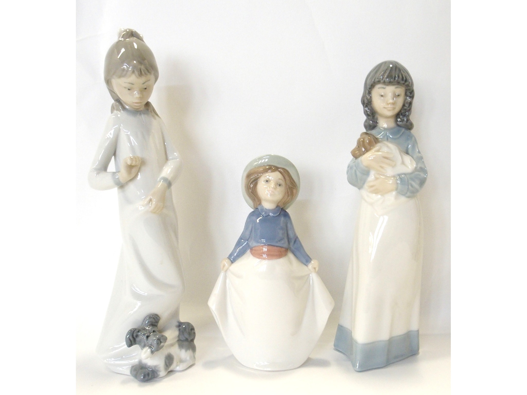 Appraisal: Three Nao figures of girls