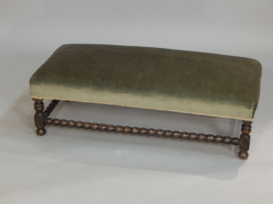 Appraisal: A rectangular oak foot stool with a padded seat on