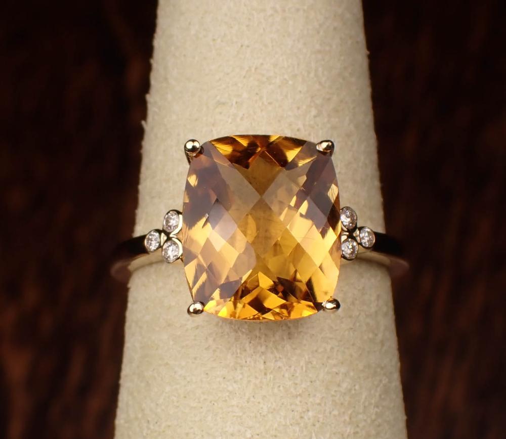 Appraisal: CITRINE DIAMOND AND FOURTEEN KARAT GOLD RING The yellow gold