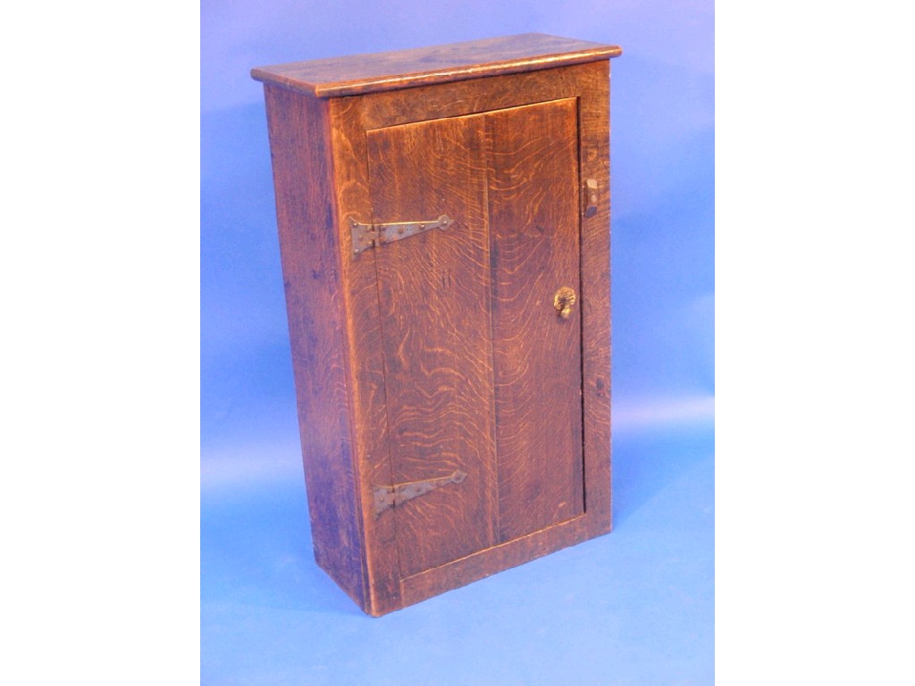 Appraisal: A thC oak cupboard with single door having raised ironwork