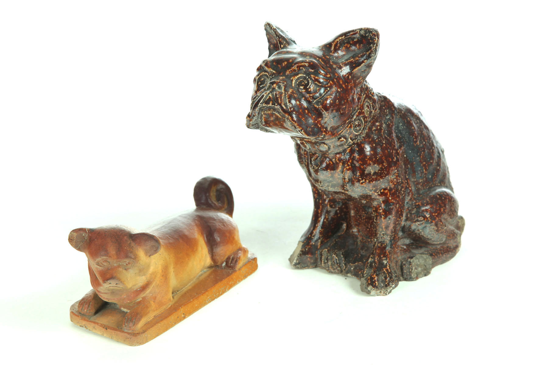 Appraisal: TWO SEWERTILE DOGS Probably Ohio early th century Small dog