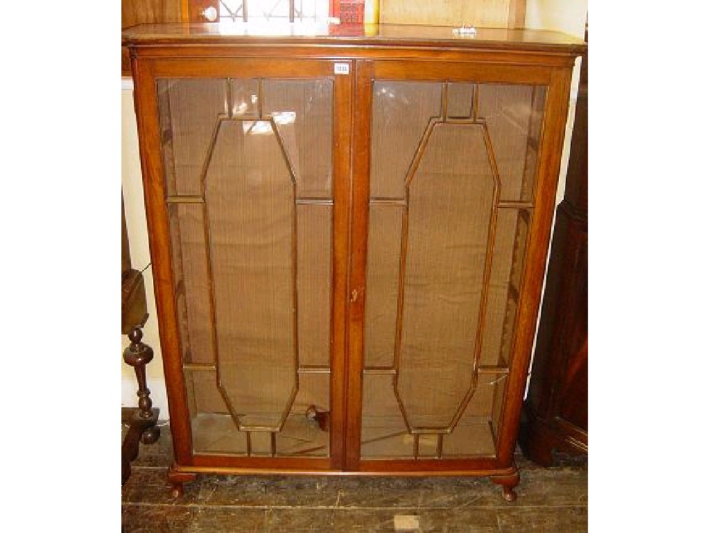 Appraisal: A th century mahogany bookcase enclosed by a pair of