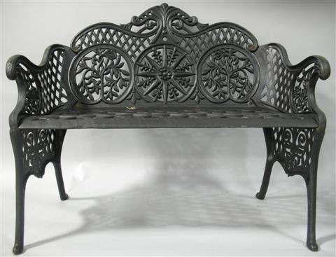 Appraisal: BLACK PAINTED WROUGHT IRON GARDEN BENCH th century the scrolling