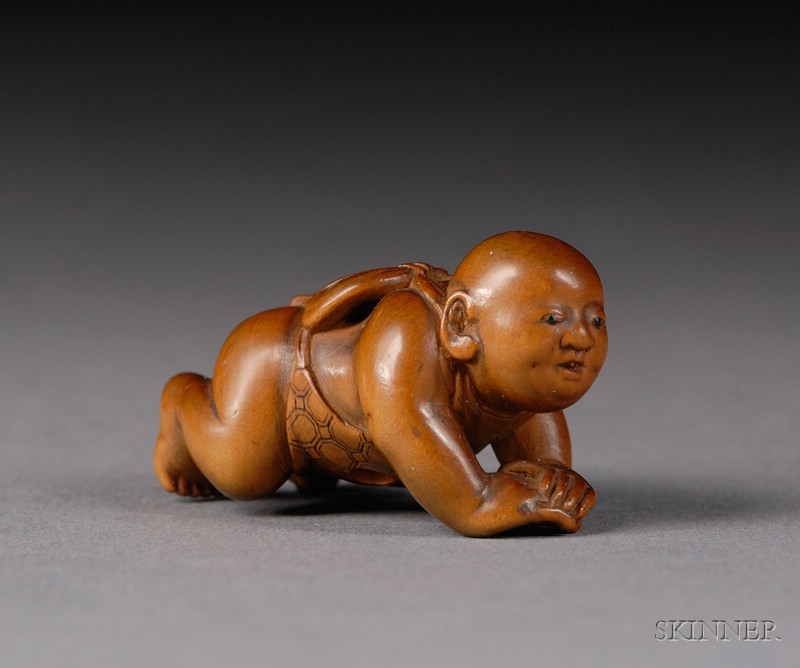 Appraisal: Boxwood Netsuke Japan th century reclining boy with inlaid eyes