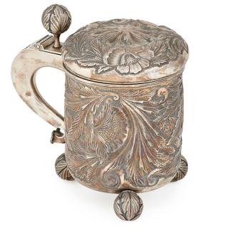 Appraisal: SWEDISH REPOUSSE SILVER TANKARD Foliate decorated throughout including the three