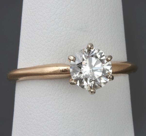 Appraisal: A diamond and gold solitaire ring diamond weighting cts