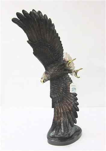 Appraisal: PATINATED BRONZE WILDLIFE SCULPTURE an American bald eagle in flight