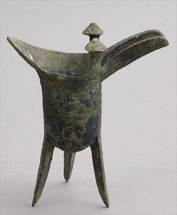 Appraisal: SHANG BRONZE TRIPOD GU Of banded helmet-form with beaker-form spout