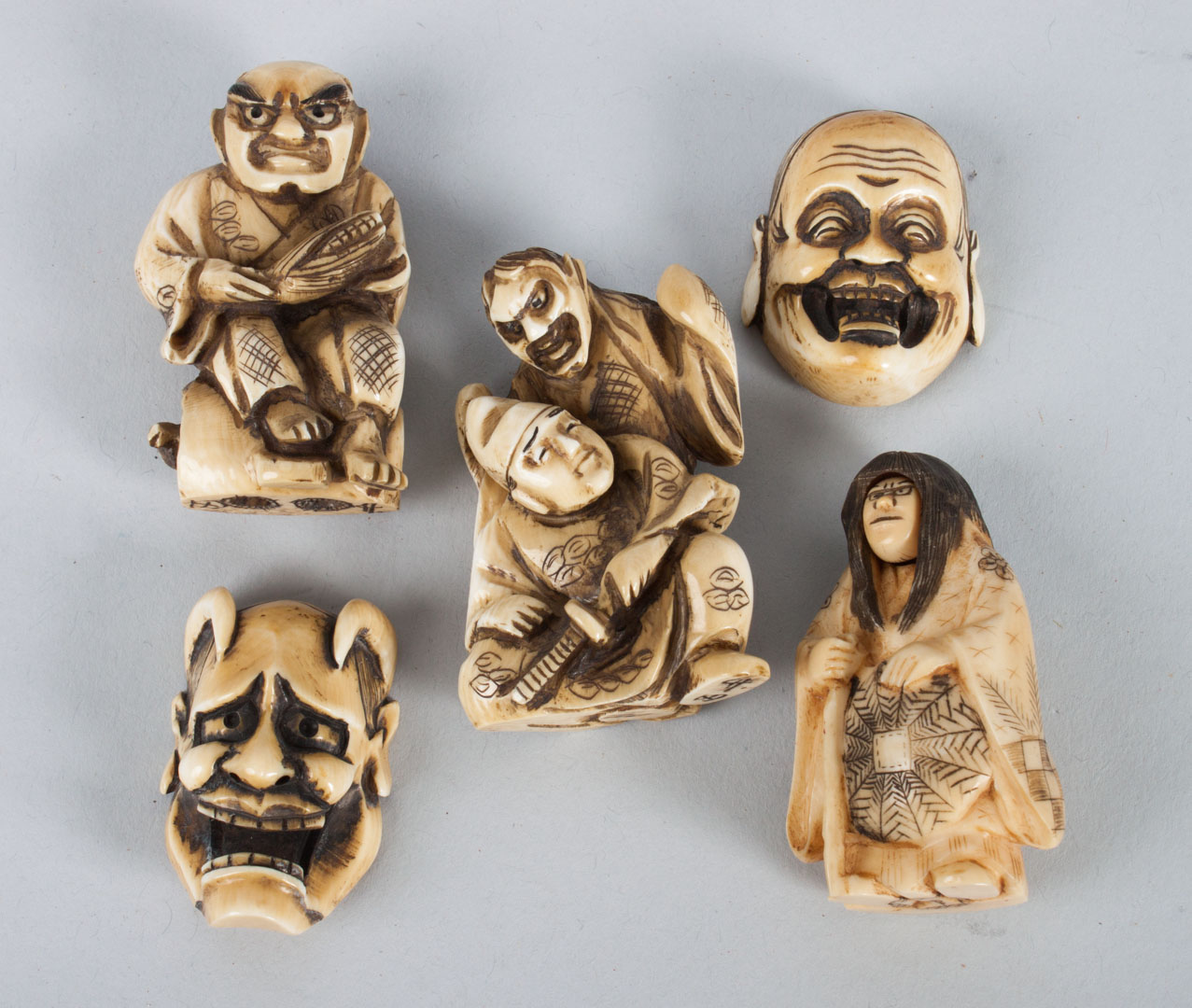 Appraisal: Five Japanese ivory demon netsukes including two figures trick netsuke