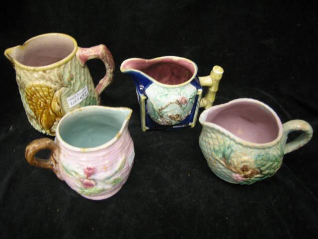 Appraisal: Majolica Pottery Creamers florals shell bird decor