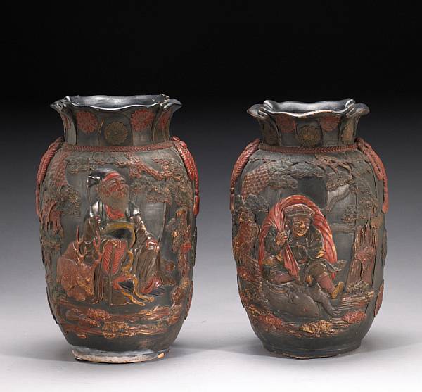 Appraisal: A pair of lacquer-painted earthenware vases Meiji Period Each molded