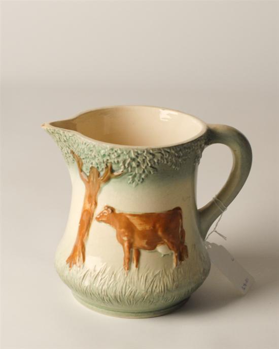 Appraisal: th C Buttermilk Pitcher with Cow Relief small chip to