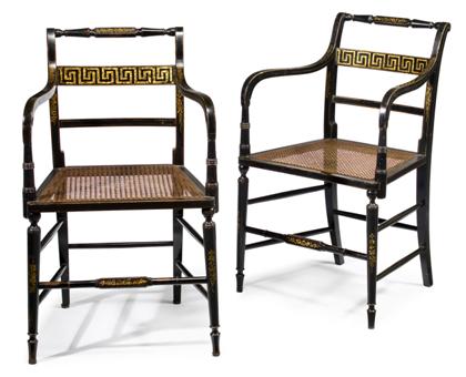 Appraisal: Pair of Regency style gilt and black painted caned armchairs