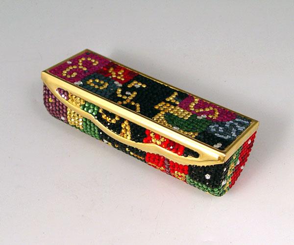 Appraisal: JUDITH LEIBER LIPSTICK COMPACT Multi colored Austrian crystal covered hinged