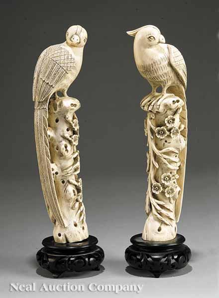 Appraisal: A Pair of Chinese Carved Ivory Phoenixes or Fenghuang late