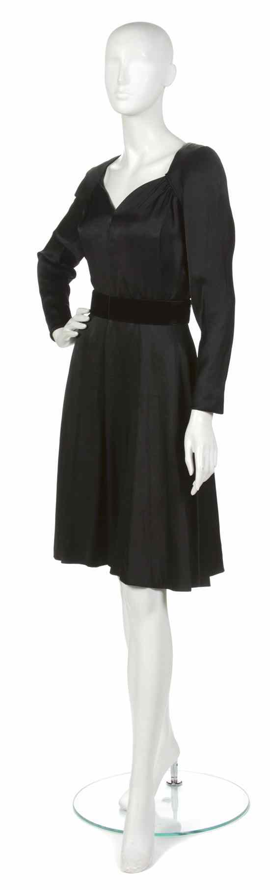 Appraisal: A Scaasi Black Silk Cocktail Dress with velvet belt Labeled