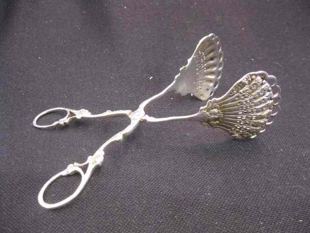 Appraisal: European Sterling Silver Pastry Tongs elaborate pierced floral shell design