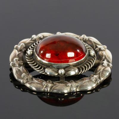 Appraisal: George Jensen a Danish silver and amber brooch no circa