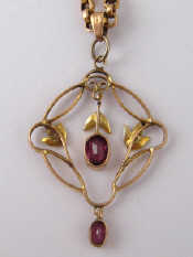 Appraisal: A carat gold Art Nouveau garnet and seed pearl pendant