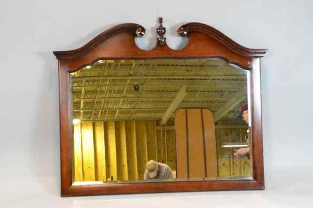 Appraisal: A MAHOGANY CHIPPENDALE STYLE WALL MIRRORBeveled mirror with arched pediment