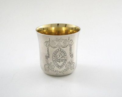 Appraisal: A modern Irish flared beaker with engraved scrolling decoration crest