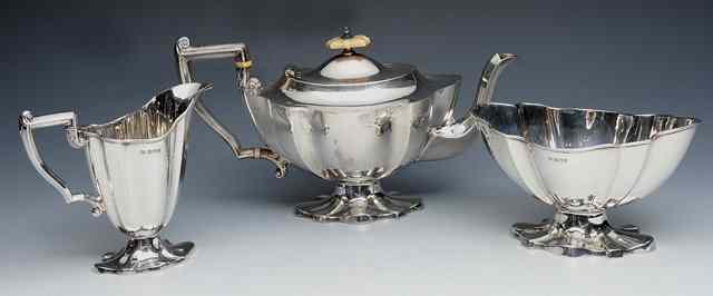 Appraisal: AN EDWARDIAN SILVER THREE PIECE TEA SET oval teapot with