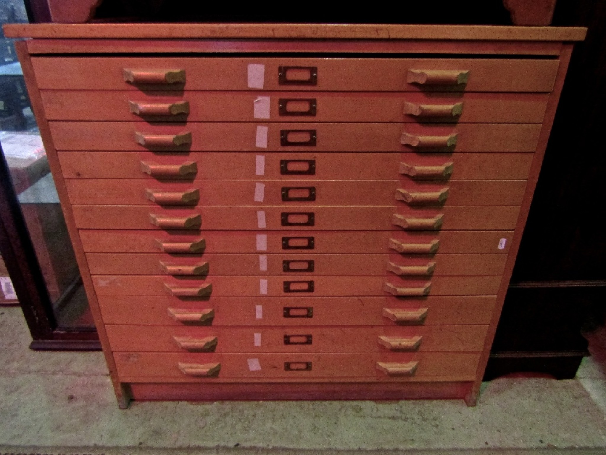 Appraisal: A light beechwood freestanding plan chest fitted with twelve shallow