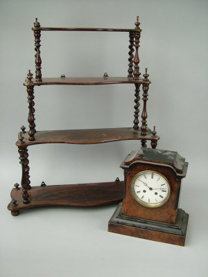 Appraisal: A Victorian rosewood graduated four tier hanging shelf with serpentine