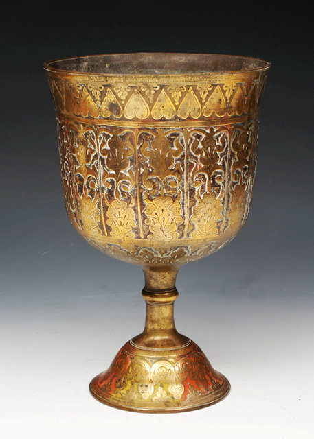 Appraisal: A SOUTH EAST ASIAN BRASS GOBLET with stylised heart and