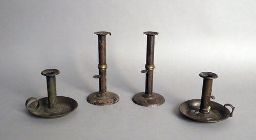 Appraisal: Pair of hogscraper candlesticks h together with two tin chambersticks