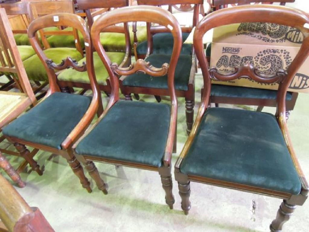 Appraisal: A set of three Victorian mahogany balloon back dining chairs