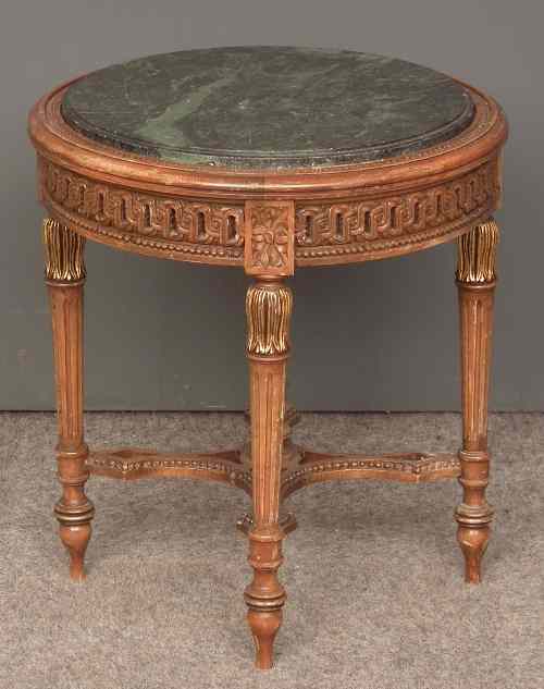 Appraisal: A French stained beechwood and gilt decorated circular occasional table