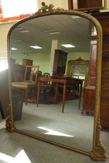 Appraisal: A th Century gilt framed overmantel mirror the arched glass