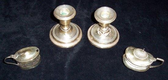 Appraisal: A pair of desk candlesticks of plain form cm high