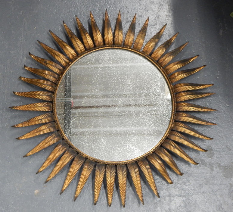 Appraisal: A decorative gilt metal sunburst mirror with circular plate cm